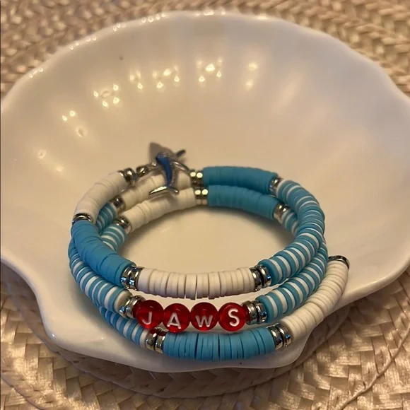 Blue and White Beaded Bracelet with Red Letter Accents Spelling Jaws - Picture 2 of 5